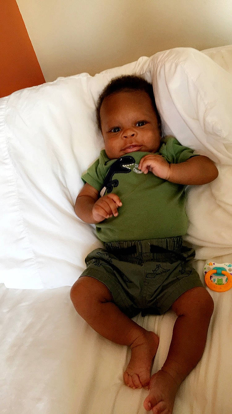 Amarion is registered to the contest to win money with this photo: abdomen, arm, baby, child, comfort, eye, finger, head, leg, nose, person, sitting, skin, thumb, toddler