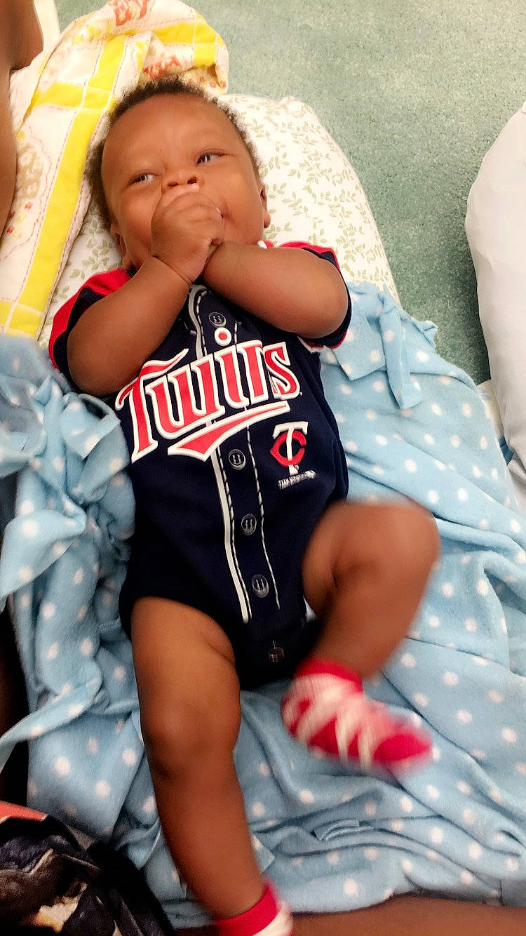 Amarion is registered to the contest to win money with this photo: arm, baby, child, leg, muscle, person, sitting, thigh, toddler