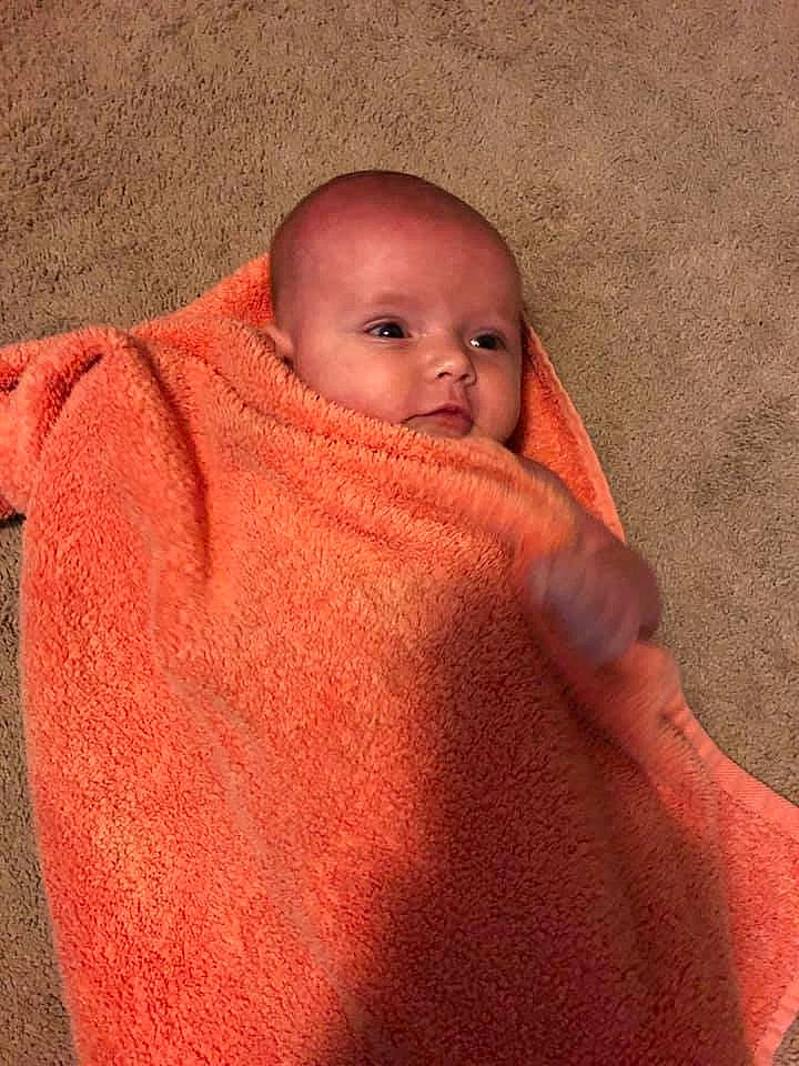 Kaomi is registered to the contest to win money with this photo: baby, child, muscle, neck, nose, orange, person, skin