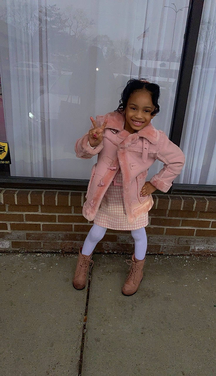 Kassidy is registered to the contest to win money with this photo: boot, child, curtain, fashion_design, flooring, foot, fun, fur, happy, human_leg, joy, knee, leg, leisure, person, sandal, sitting, sleeve, smile, sock