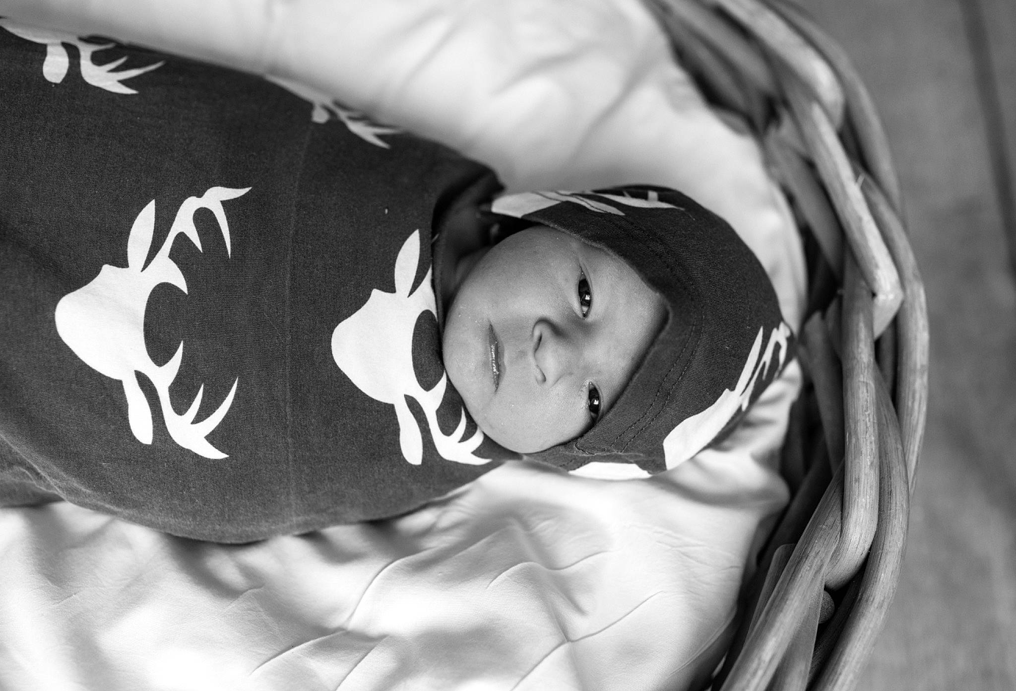 Jaxon is registered to the contest to win money with this photo: baby, baby_products, baby_toddler_clothing, black_and_white, child, comfort, elbow, flash_photography, grass, happy, headwear, monochrome, monochrome_photography, pattern, person, portrait_photography, room, sitting, sleep, sleeve