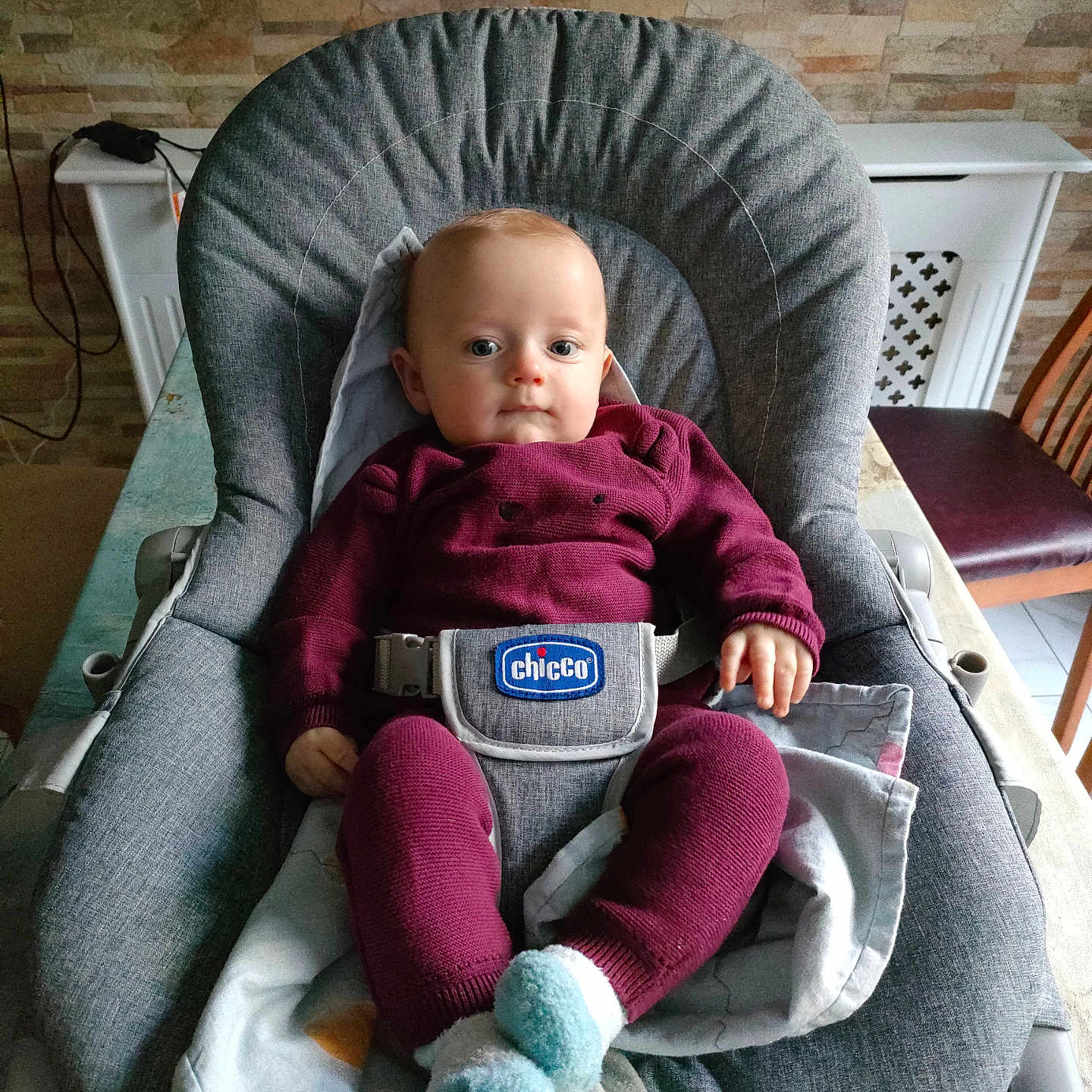 Antanas joined the competition — help win amazing prizes! baby, baby_belt, baby_chair, blanket, brick_pattern, child, curious, face, grey_chair, homedecor, indoor, infant, maroon_clothing, person, seated, socks, soft_lighting, table, wall, wooden_chair