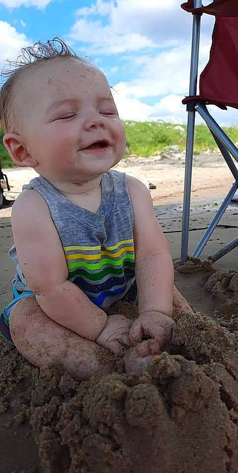 Austyn is registered to the contest to win money with this photo: child, fun, mud, person, play, sand, smile, soil, toddler, vacation