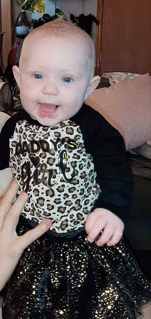 Emmaline Coon joined the competition — help win amazing prizes! baby, baby_toddler_clothing, cheek, child, design, dress, head, pattern, person, sitting, skin, smile, toddler