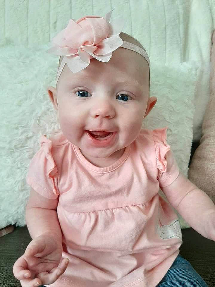 Emmaline Coon joined the competition — help win amazing prizes! baby, baby_toddler_clothing, cheek, child, child_model, eye, face, fashion_accessory, hair_accessory, head, headband, headgear, headwear, lip, person, pink, skin, sleeve, smile, toddler