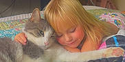 Marceline joined the competition — help win amazing prizes! child, cat, bed, blanket, pillow, computer, monitor, fan, backpack, bedroom, pet, cuddling, blond_hair, smile, closed_eyes, paw, fur, cozy, friendship, indoor
