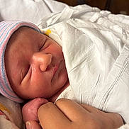 Marcus joined the competition — help win amazing prizes! newborn, baby, infant, sleeping, hat, blanket, hospital, hand, holding, skin, face, peaceful, closeup, portrait, child, swaddled, cute, tiny, resting, gentle
