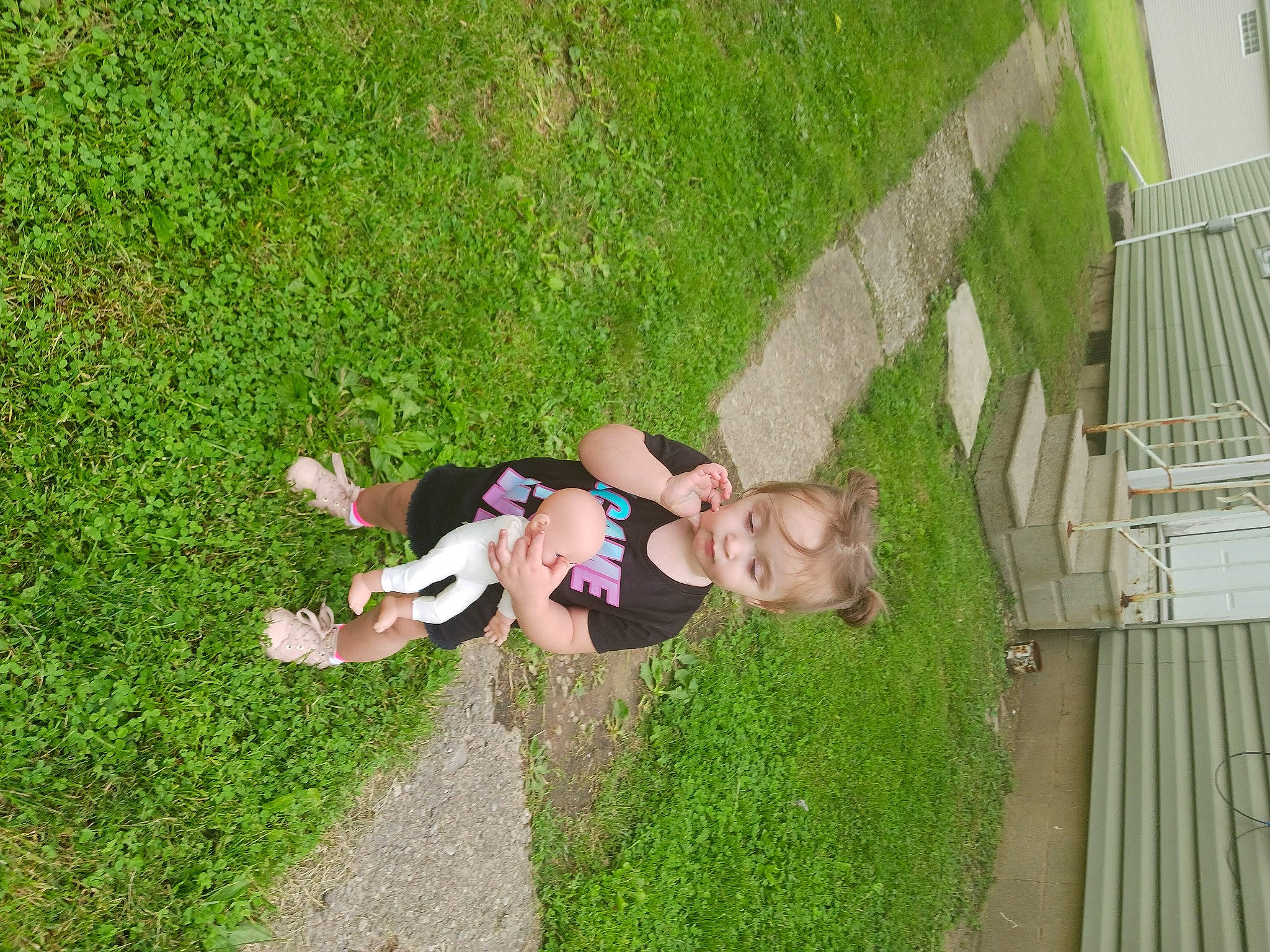 Isabella is registered to the contest to win money with this photo: flooring, fun, garden, grass, grass_family, grassland, green, groundcover, happy, landscape, lawn, leaf, leisure, people_in_nature, person, plant, porch, recreation, shrub, toddler