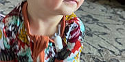 Scarlett joined the competition — help win amazing prizes! toddler, child, blue_eyes, colorful_clothing, patterned_outfit, sitting, carpet, indoor, floor, hand, foot, curious, young_child, skin, person, home, cute, infant, baby, portrait
