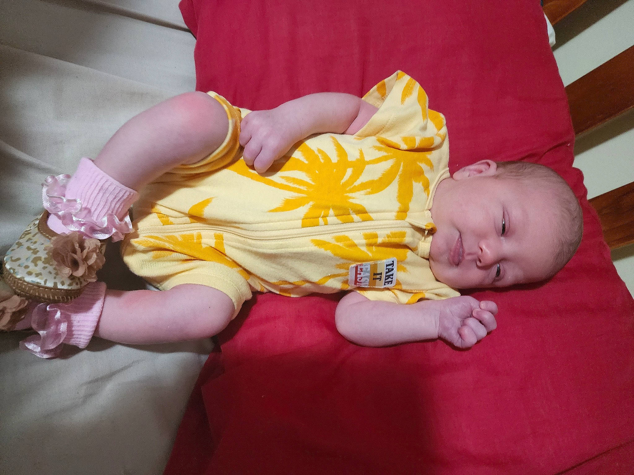 Mika is registered to the contest to win money with this photo: abdomen, baby, baby_toddler_clothing, child, comfort, couch, dress, finger, fun, hand, human_body, human_leg, lap, leg, magenta, person, pink, purple, skin, thigh