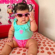 Sharlotte joined the competition — help win amazing prizes! baby, child, sunglasses, pigtails, turquoise_top, pink_shorts, cushion, floral_pattern, minnie_mouse, indoor, cute, portrait, toddler, fashion, accessory, wall, seated, hand, foot, pacifier