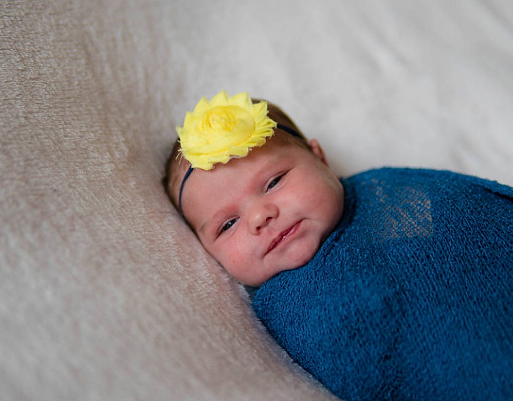 Dakota joined the competition — help win amazing prizes! arm, baby, baby_sleeping, baby_toddler_clothing, cheek, comfort, fashion_accessory, flower, grass, hair, hair_accessory, head, headwear, iris, linens, lip, pattern, person, petal, plant