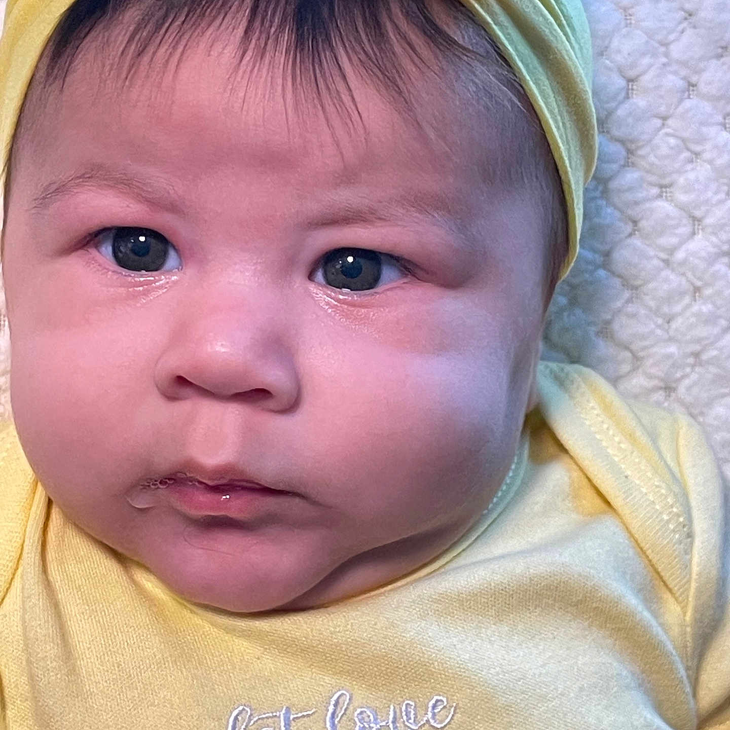 Astrid álvarez joined the competition — help win amazing prizes! adorable, baby, child, close_up, clothing, cute, expression, eyes, face, hand, headwear, infant, mouth, newborn, pink_handprints, portrait, skin, soft_blanket, yellow_headband, yellow_onesie