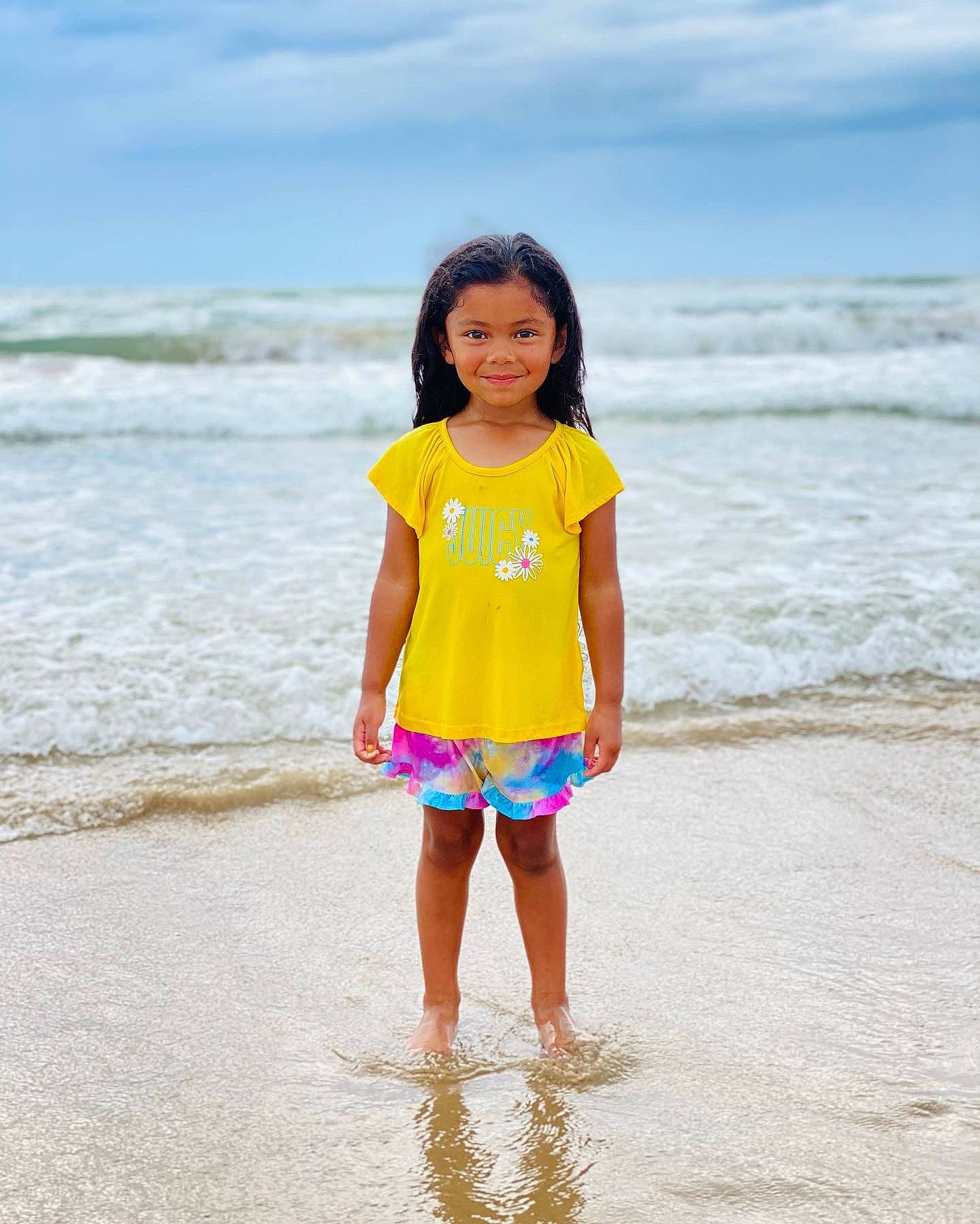 Zoe joined the competition — help win amazing prizes! azure, beach, body_of_water, cloud, coastal_and_oceanic_landforms, eye, fun, happy, head, human_body, joy, leisure, people_in_nature, people_on_beach, person, sky, sleeve, t_shirt, toddler, travel