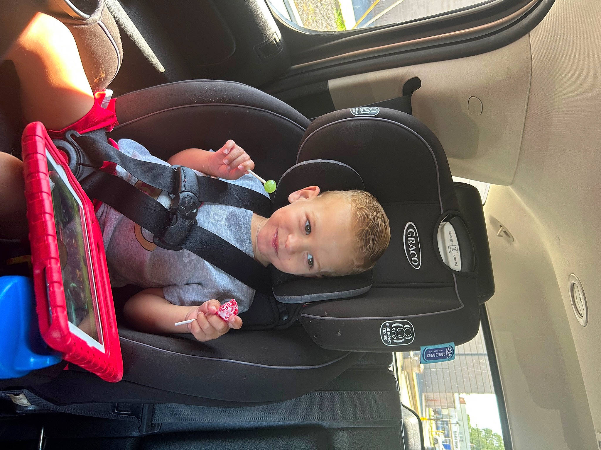 Kaiden is registered to the contest to win money with this photo: auto_part, automotive_design, baby, baby_carriage, baby_in_car_seat, baby_products, car_seat, car_seat_cover, child, comfort, family_car, head_restraint, joy, luxury_vehicle, motor_vehicle, person, personal_protective_equipment, seat_belt, steering_part, steering_wheel