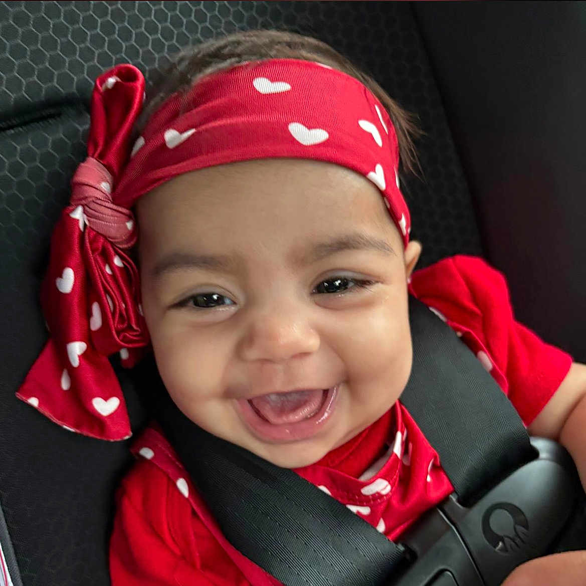 Bella is registered to the contest to win money with this photo: accessories, baby, babylaughing, bandana, clothing, cushion, face, happy, head, headband, homedecor, jewelry, laughing, necklace, person, photography, portrait, scarf, smile, sunglasses