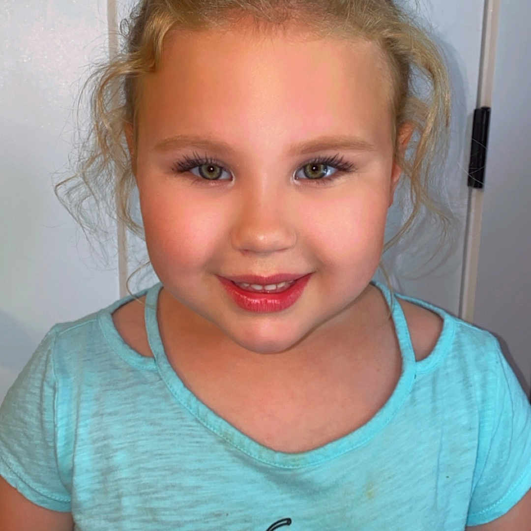 Lyla joined the competition — help win amazing prizes! applique, blonde, bodypart, child, clothing, cosmetics, face, female, girl, hair, happy, head, lipstick, pattern, person, photography, portrait, smile, t_shirt, whiteboard