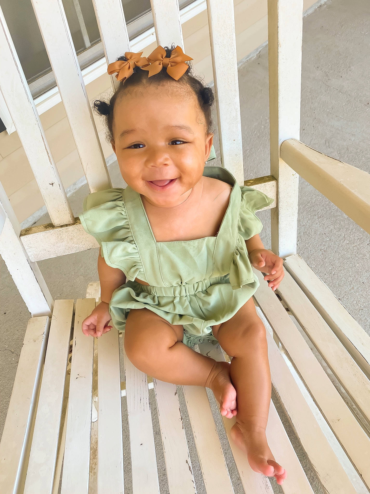 Raelynn is registered to the contest to win money with this photo: baby_toddler_clothing, barefoot, child, chin, eyewear, flooring, foot, fun, happy, hardwood, human_leg, joy, pattern, person, sleeve, smile, sunglasses, thigh, thumb, toddler