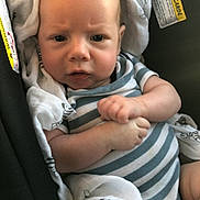 Matthias joined the competition — help win amazing prizes! baby, infant, car_seat, striped_clothing, blanket, face, expression, curious, frown, hands, skin, head, person, child, indoor, warning_label, fabric, seat, closeup, newborn