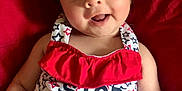 Kaia joined the competition — help win amazing prizes! baby, infant, smiling, face, eyes, arms, clothing, red, white, blue, stars, pattern, text, happy, portrait, closeup, cute, sitting, fabric, bracelet