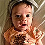 Kaia joined the competition — help win amazing prizes! baby, infant, headband, pineapple_print, orange_shirt, clothing, face, eyes, mouth, expression, skin, hair, lying_down, bed, blanket, cute, child, person, portrait, indoors
