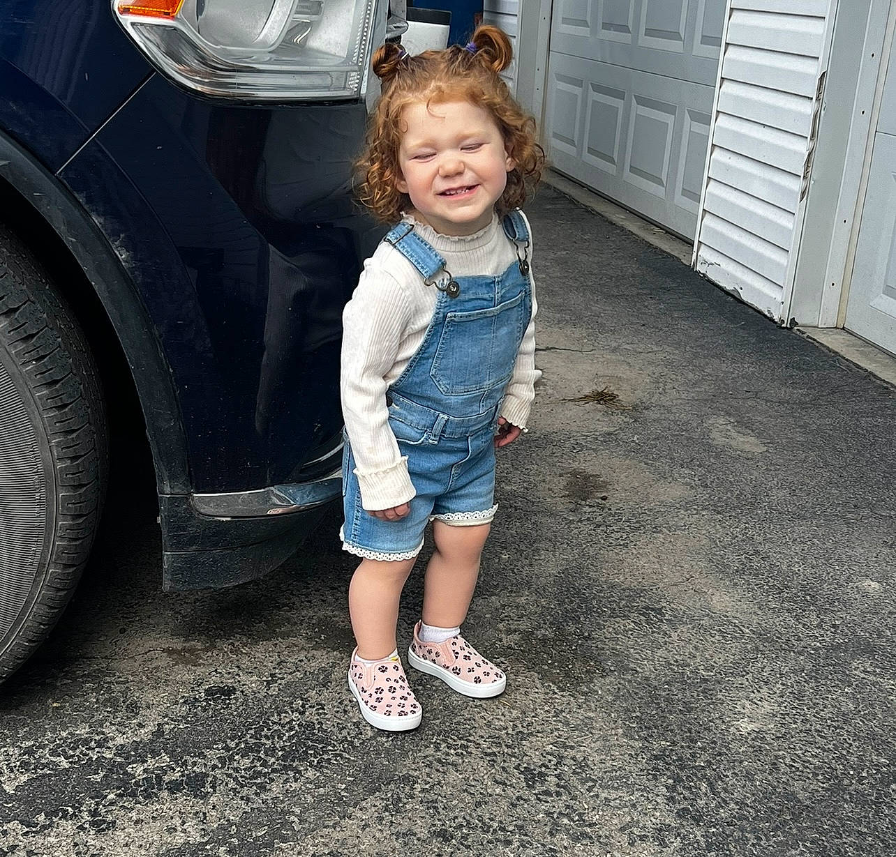Zaylee joined the competition — help win amazing prizes! alloy_wheel, asphalt, automotive_exterior, automotive_lighting, automotive_tire, bumper, car, door, face, fender, hood, joy, leg, motor_vehicle, person, shorts, tire, toddler, tread, vehicle_door