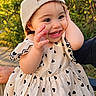 Edith joined the competition — help win amazing prizes! adult_arm, baby, cap, child, dress, eyes, face, greenery, happy, heart_pattern, laughing, nature, outdoor, photography, portrait, smiling, sunlight, teeth, toddler, waving