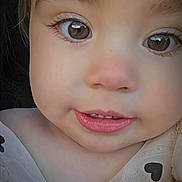 Edith joined the competition — help win amazing prizes! baby, brown_eyes, child, close_up, clothing, curious, cute, eyelashes, eyes, face, head, heart_pattern, outdoor, person, photograph, portrait, rosy_cheeks, skin, smiling, toddler