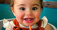 Edith joined the competition — help win amazing prizes! baby, background, child, clothing, cup, drink, eyes, face, hair, hand, happy, highchair, indoor, orange, person, portrait, seat, skin, smiling, toddler
