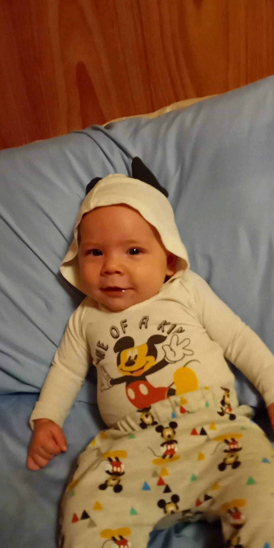 Emery is registered to the contest to win money with this photo: baby, baby_products, baby_toddler_clothing, cap, cheek, child, comfort, fun, happy, hat, headwear, linens, person, sitting, skin, sleeve, smile, t_shirt, toddler