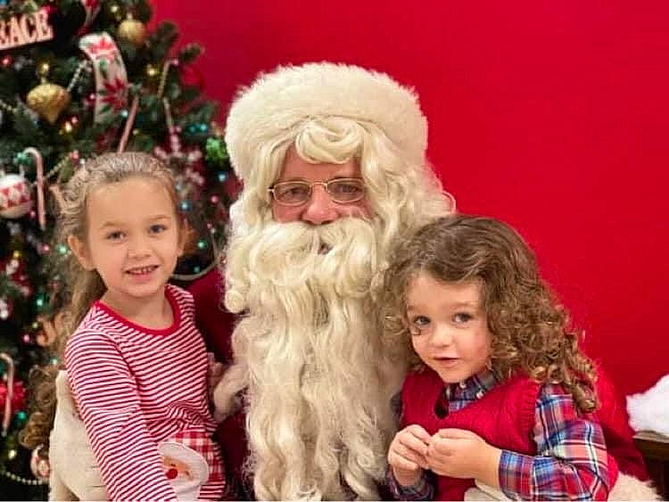 Kyra joined the competition — help win amazing prizes! beard, child, christmas, christmas_eve, christmas_tree, clothing, costume_hat, event, facial_hair, fictional_character, fun, fur, happy, hat, holiday, joy, lap, people, person, santa_claus