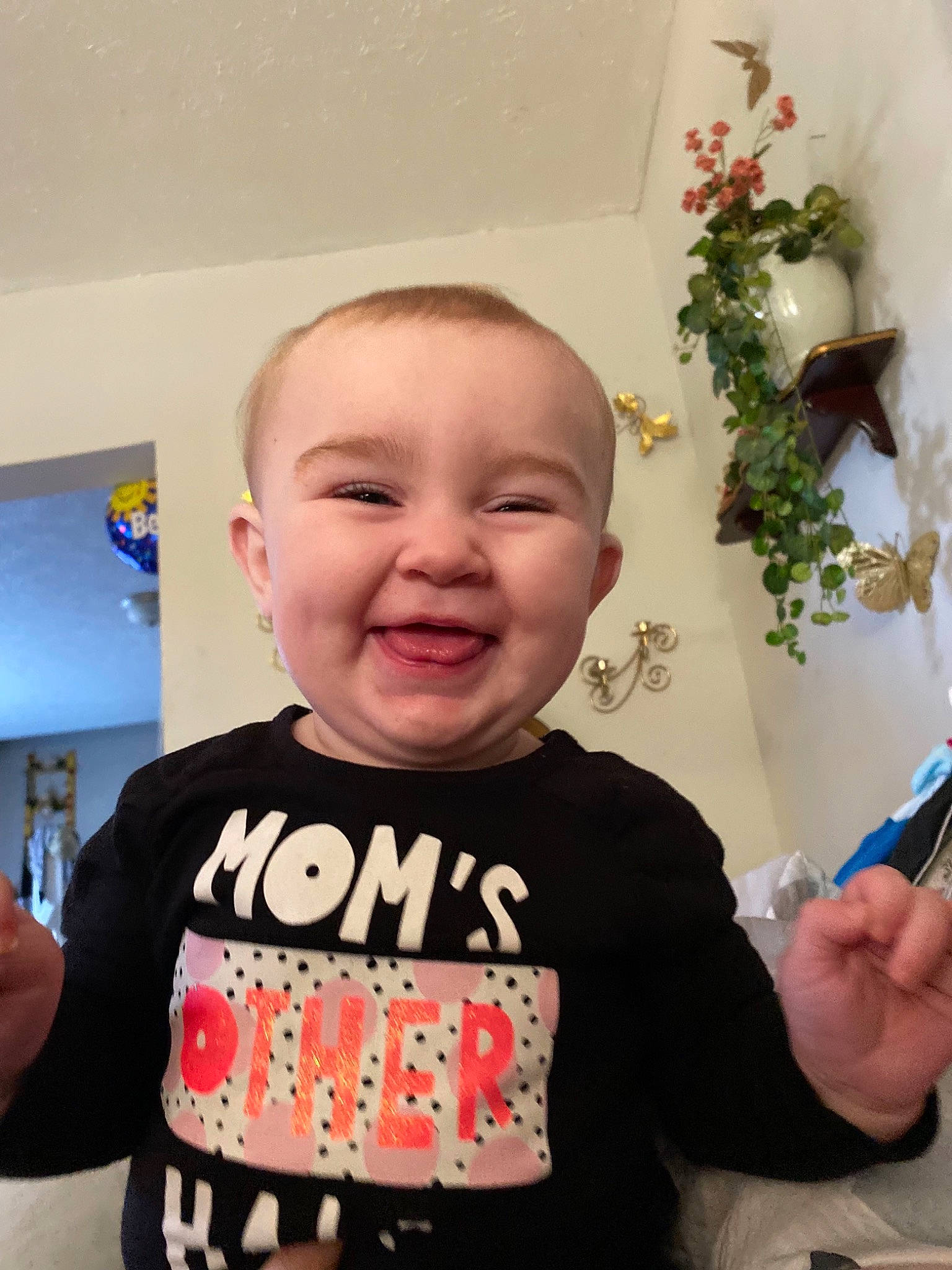 Brinleigh is registered to the contest to win money with this photo: arm, baby, baby_toddler_clothing, child, electric_blue, event, finger, flower, fun, gesture, happy, joy, laugh, magenta, person, plant, sleeve, smile, t_shirt, thumb