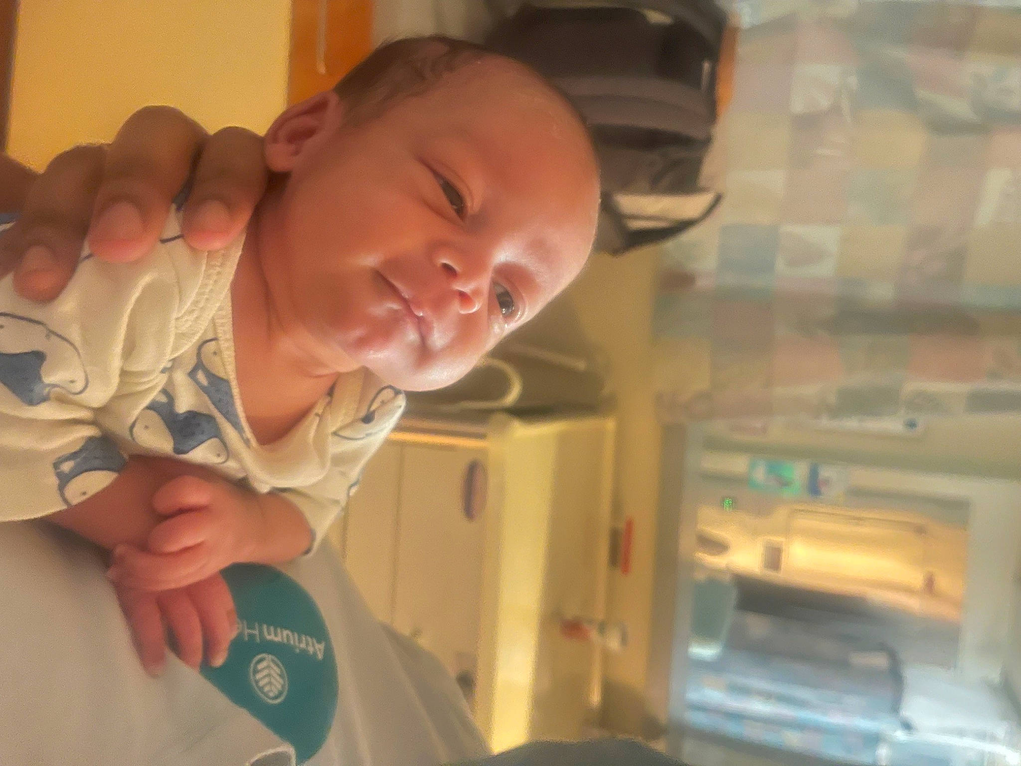 Keith is registered to the contest to win money with this photo: baby, baby_toddler_clothing, cheek, child, chin, comfort, ear, eyebrow, finger, fun, gesture, human_body, iris, mouth, neck, nose, person, skin, sleeve, thumb