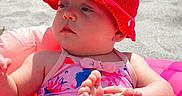 Kelsi is registered to the contest to win money with this photo: baby, infant, beach, sand, sunhat, red_hat, swimsuit, inflatable_ring, pink, feet, child, summer, outdoor, relaxed, cute, sunny, vacation, toy_bucket, play, leisure