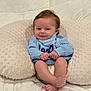 baby, infant, smile, blue_sweater, pillow, diaper, cute, cozy, soft_texture, bed, child, person, happy, indoors, skin, feet, hands, head, face, young