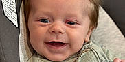 Logan is registered to the contest to win money with this photo: baby, smile, infant, face, clothing, seat, happy, child, portrait, indoor, cute, apparel, person, newborn, babywear, expression, infancy, seatbelt, comfort, relaxation