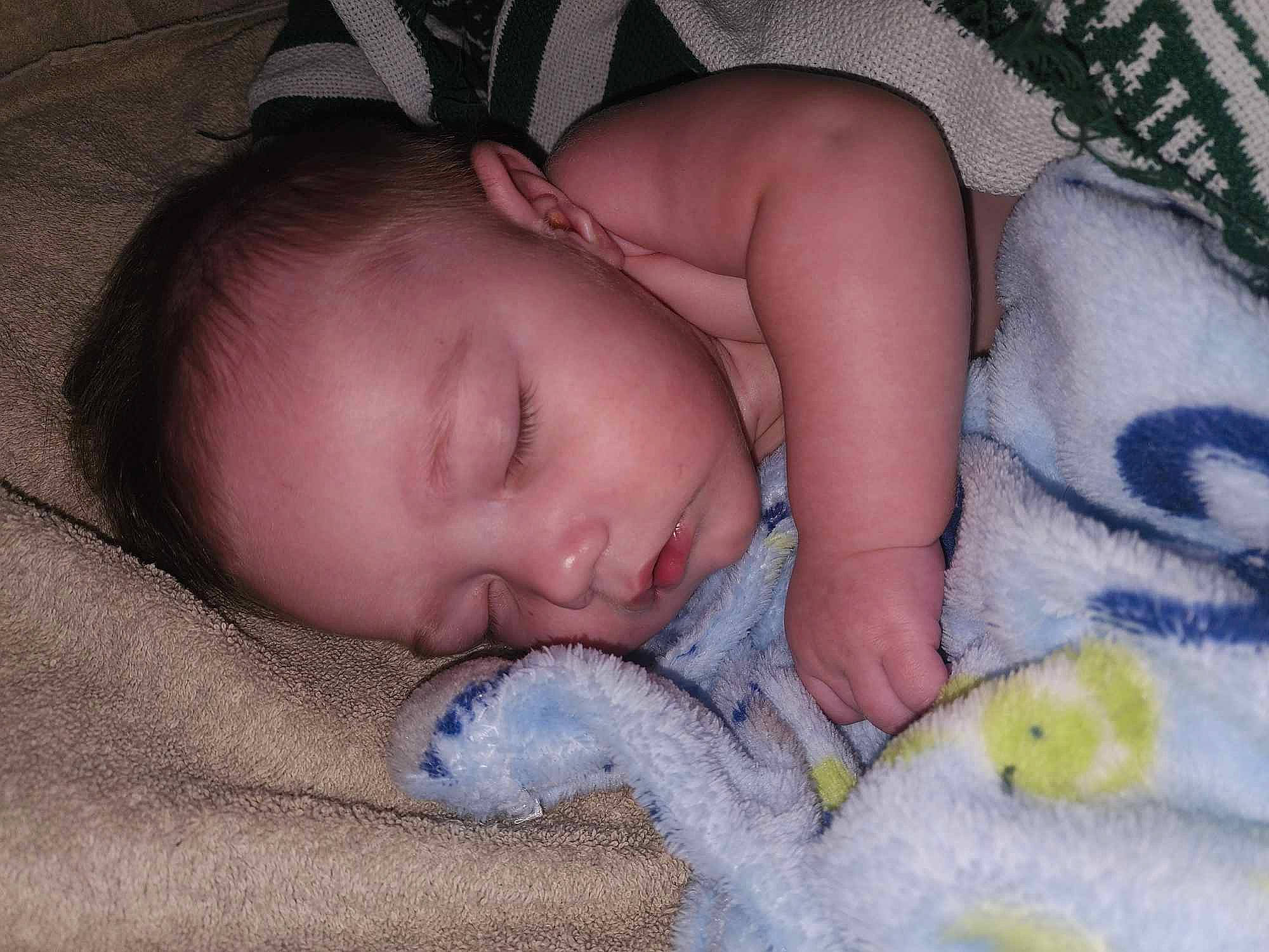 Aven is registered to the contest to win money with this photo: baby, baby_sleeping, baby_toddler_clothing, bed, bedding, bedtime, cheek, child, comfort, linens, mammal, mouth, nap, nose, person, room, skin, sleep, textile, toddler