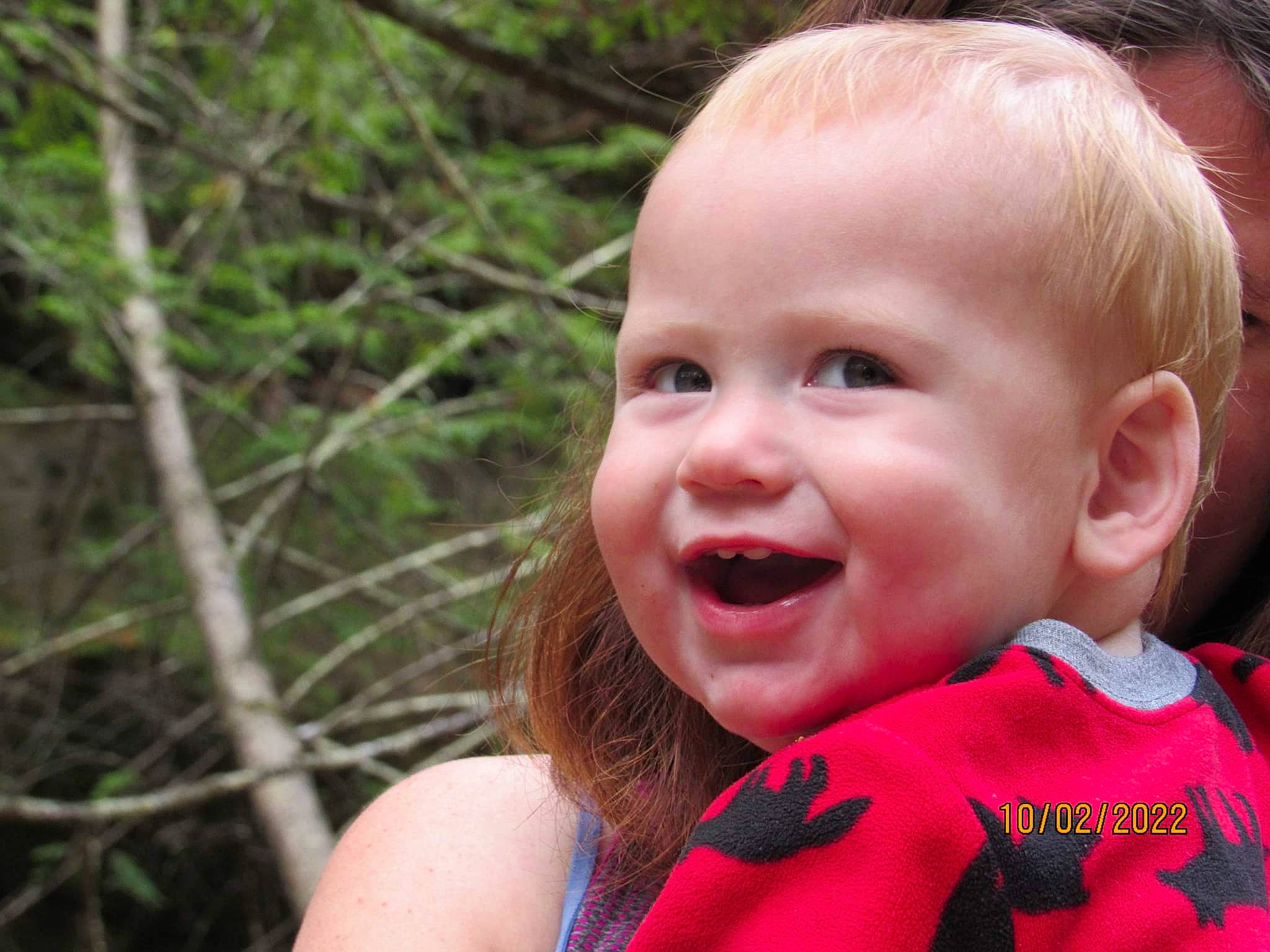 Hayden is registered to the contest to win money with this photo: baby, baby_toddler_clothing, blond, child, event, fun, grass, happy, human_body, iris, joy, lip, nose, people_in_nature, person, plant, recreation, skin, smile, toddler