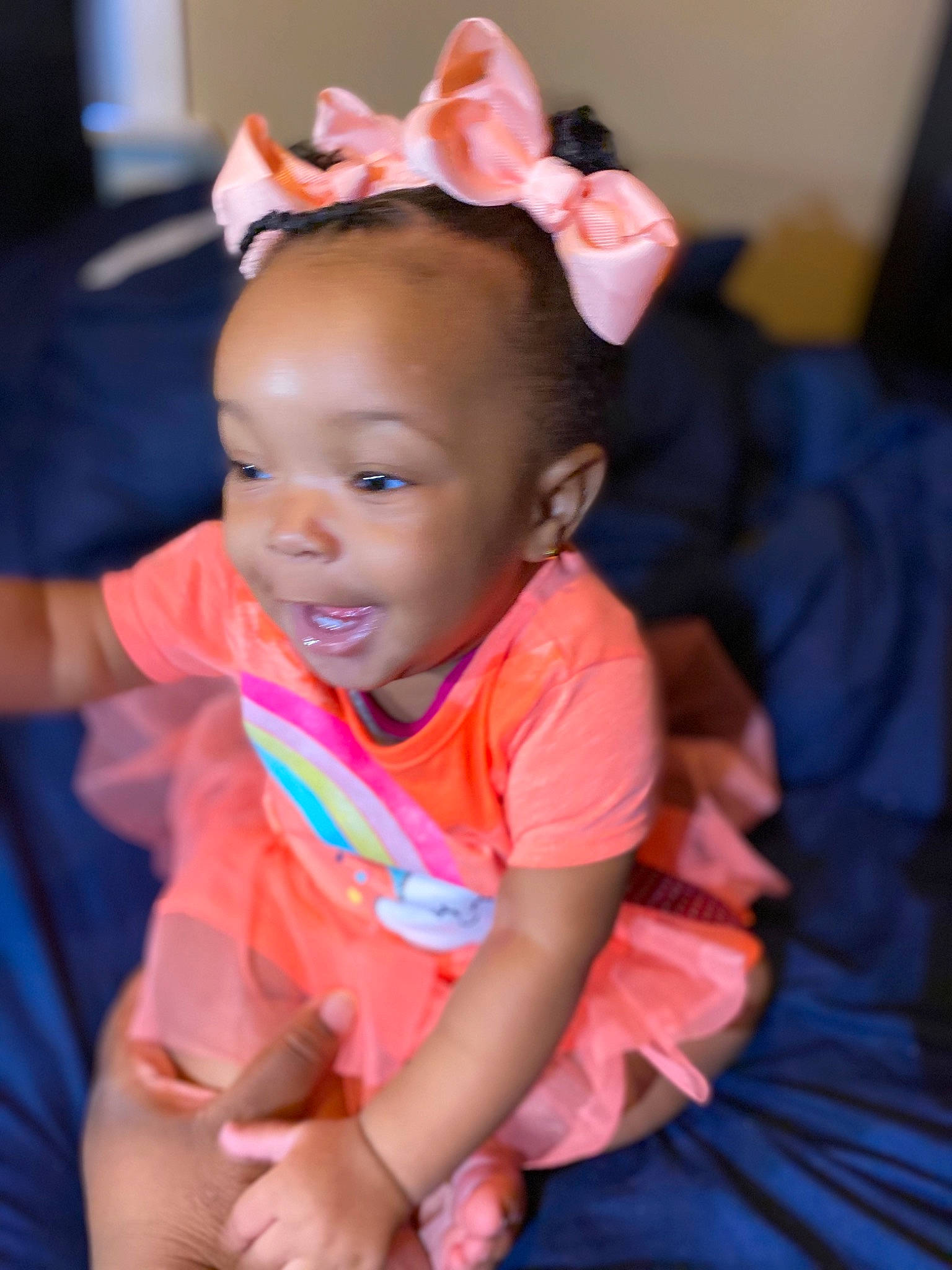 Isabella is registered to the contest to win money with this photo: baby, beauty, cheek, child, ear, eye, face, fashion_accessory, hair_accessory, head, headband, headgear, iris, lip, party, person, pink, sitting, skin, smile