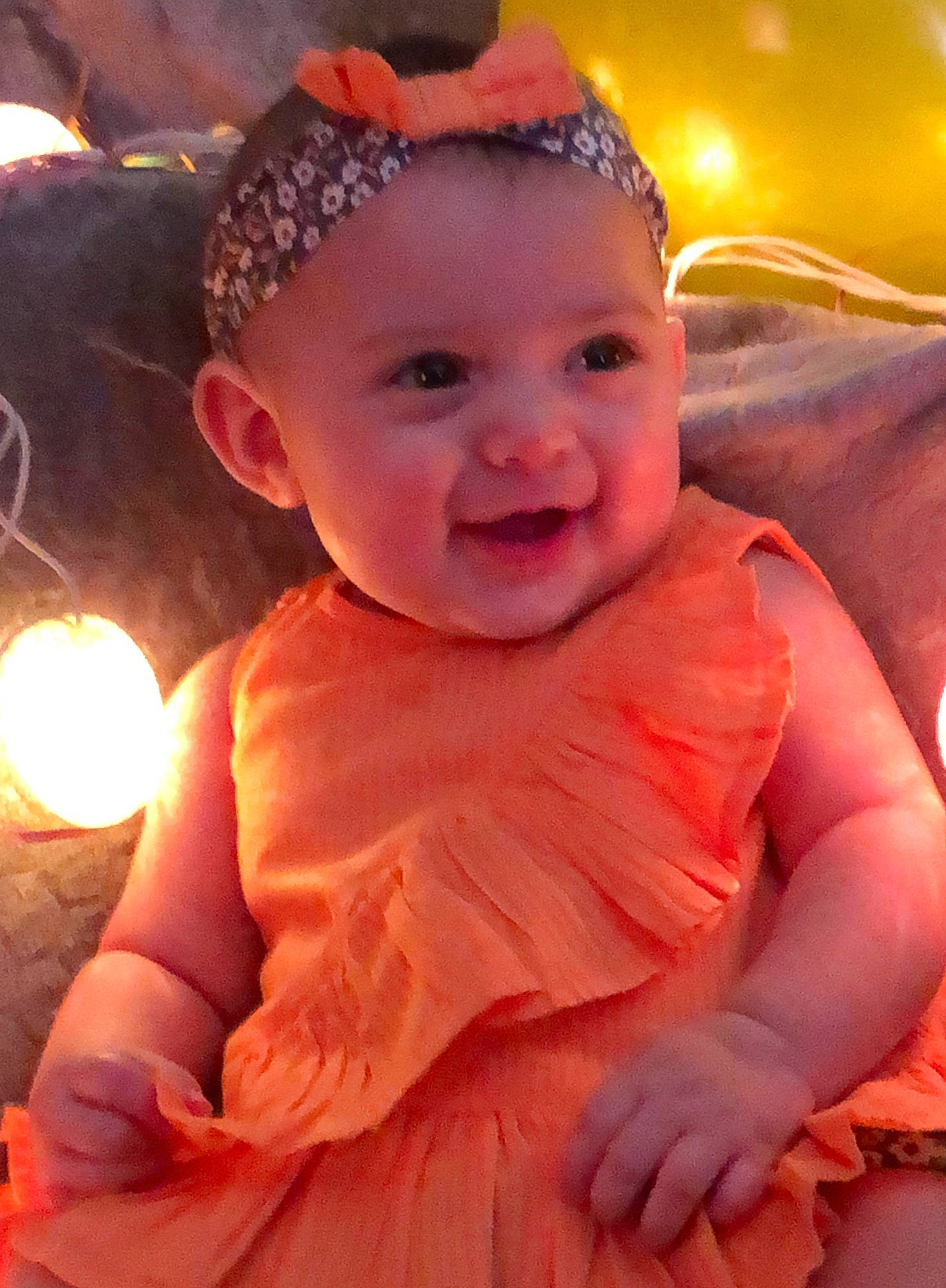 Rosalyn is registered to the contest to win money with this photo: baby, baby_toddler_clothing, cheek, chin, face, facial_expression, flash_photography, gesture, hairstyle, happy, head, iris, lip, mammal, mouth, person, pink, skin, smile, standing