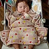 baby, blanket, baby_seat, sleeping, indoors, footwear_absent, pink, patterned_blanket, wooden_floor, child, cute, resting, infant, cozy, comfort, toddler, face, hands, feet, clothing