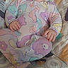 Hazel is registered to the contest to win money with this photo: baby, smiling, pajamas, baby_seat, fisher_price, indoor, happy, child, cute, infant, patterned_clothing, face, person, seat, toy, comfort, colorful, child_care, portrait, young
