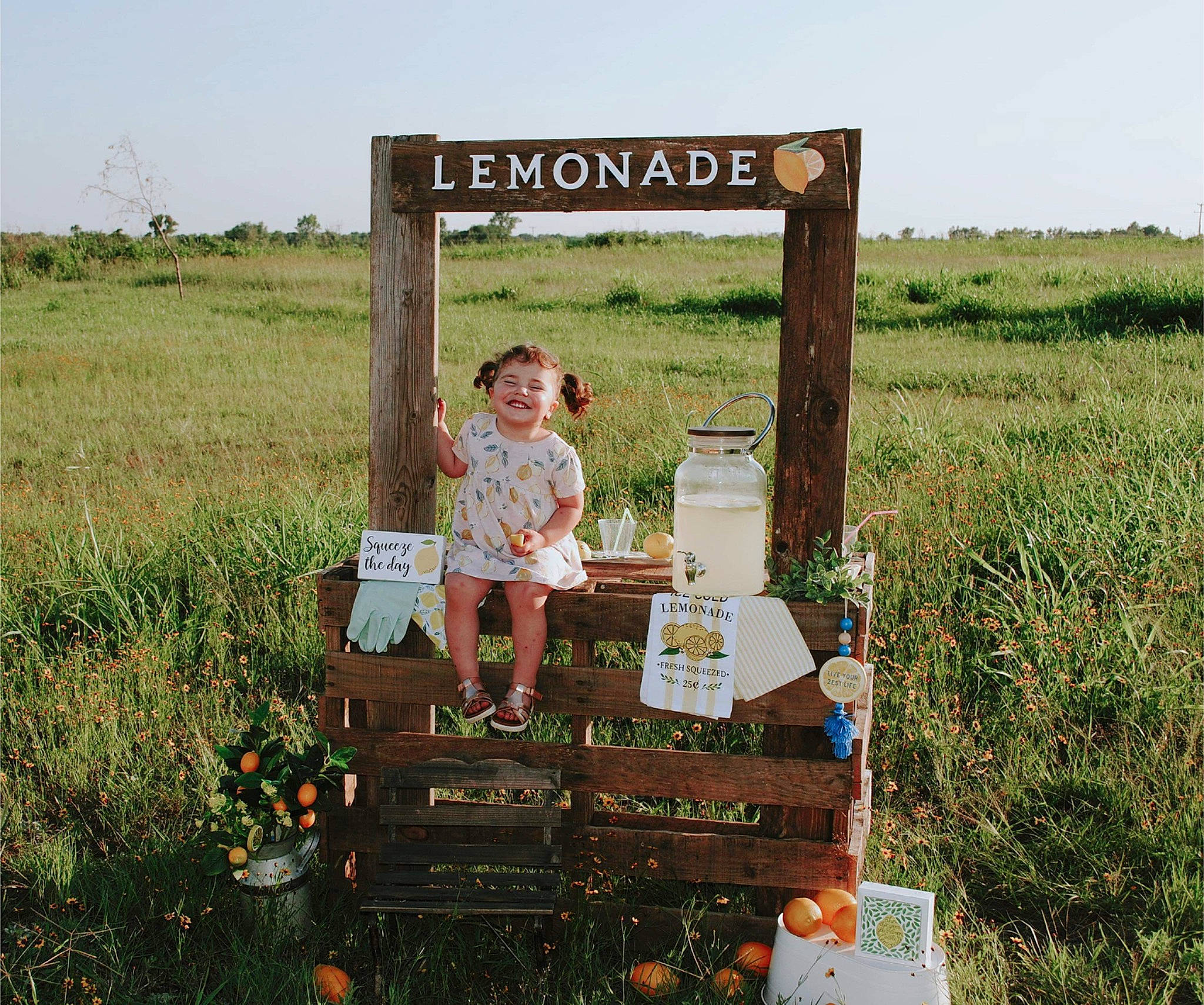 Grace is registered to the contest to win money with this photo: adaptation, agriculture, field, flower, grass, grassland, happy, joy, landscape, meadow, natural_landscape, pasture, people_in_nature, person, plant, prairie, rural_area, shorts, shrub, sky