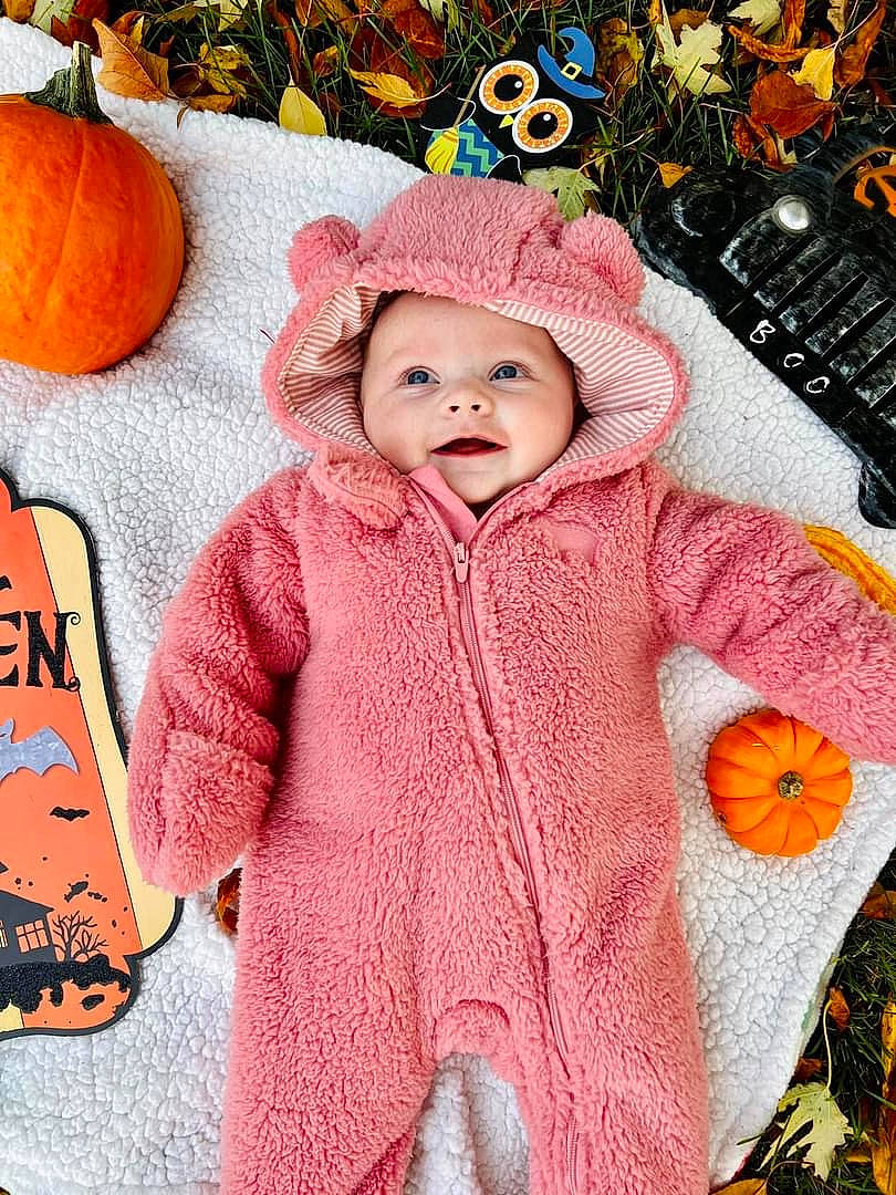 Cora joined the competition — help win amazing prizes! baby, baby_toddler_clothing, calabaza, cheek, child, clothing, face, happy, head, headwear, jacket, orange, organ, outerwear, people, person, photograph, plant, pumpkin, sleeve