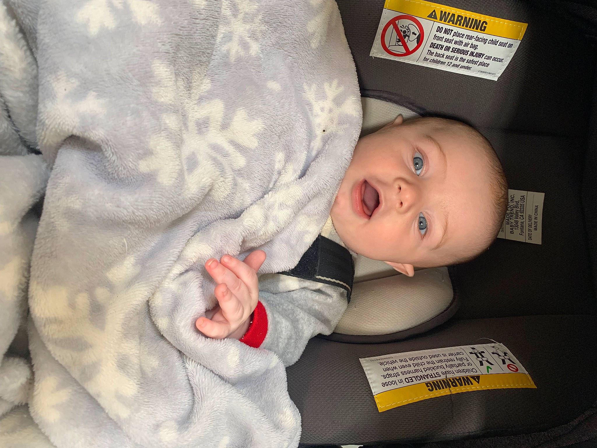 Arrow is registered to the contest to win money with this photo: baby, baby_products, baby_safety, baby_toddler_clothing, cheek, child, comfort, eye, gesture, infant_bed, linens, pattern, person, room, sitting, skin, sleeve, smile, toddler