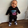 Melaya is registered to the contest to win money with this photo: baby, babylaughing, clothing, face, footwear, happy, hardwood, head, jeans, laughing, pants, person, photography, portrait, shoe, sitting, smile, sneaker, t_shirt, wood