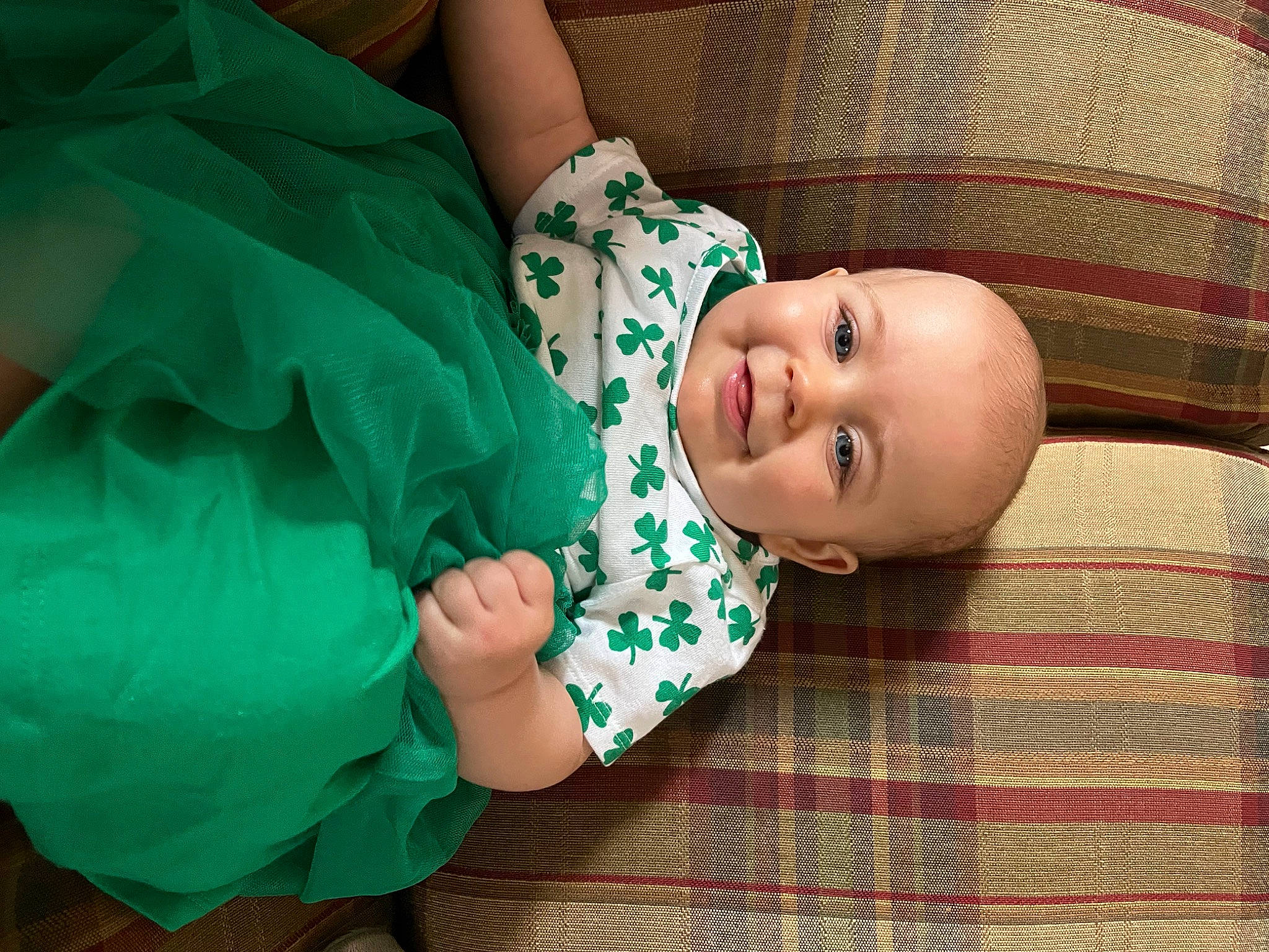 Sera joined the competition — help win amazing prizes! baby, baby_toddler_clothing, child, comfort, event, fun, grass, green, hand, happy, joy, pattern, person, plaid, sitting, sleeve, smile, tartan, textile, toddler