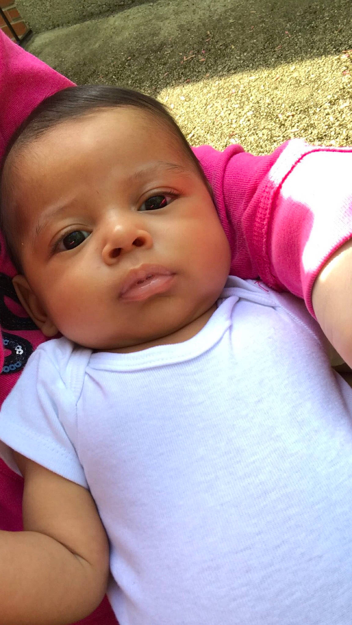 Omar is registered to the contest to win money with this photo: baby, baby_toddler_clothing, black_hair, cheek, cool, eyebrow, eyelash, gesture, hand, happy, human_body, iris, lip, mouth, nose, person, pink, skin, smile, toddler