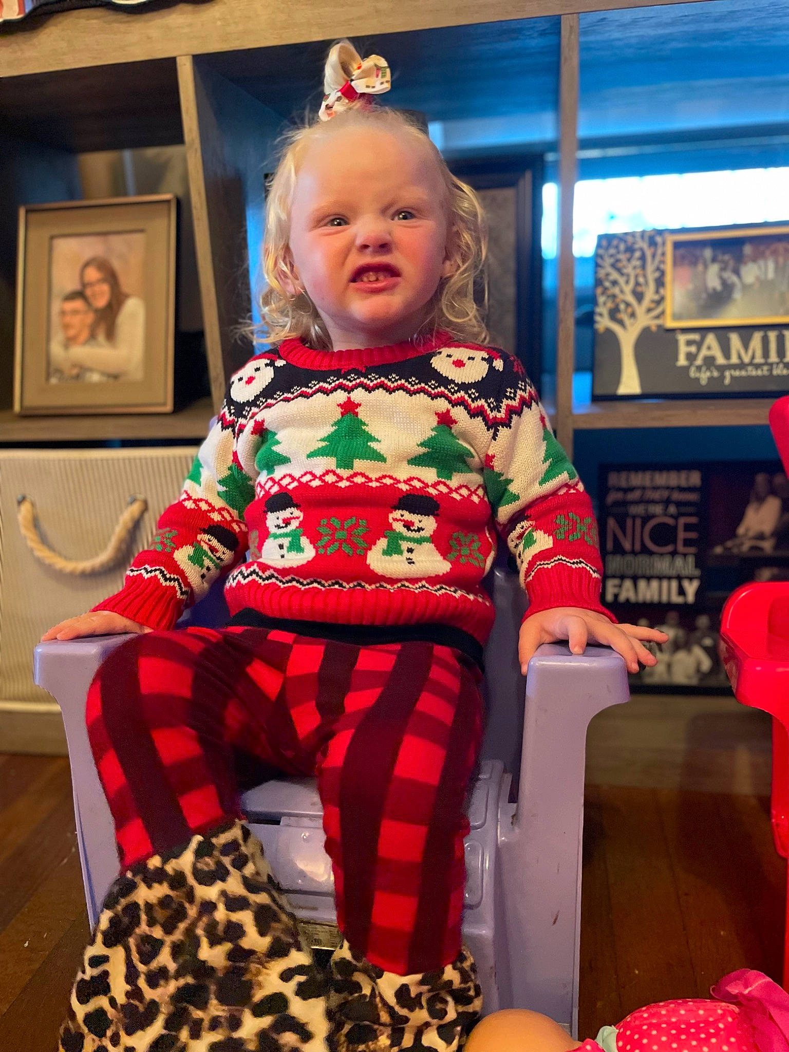 Calandra is registered to the contest to win money with this photo: baby, baby_toddler_clothing, blurred, chair, child, comfort, design, event, fashion, fashion_design, fun, holiday, lap, magenta, pattern, person, picture_frame, pink, red, sitting