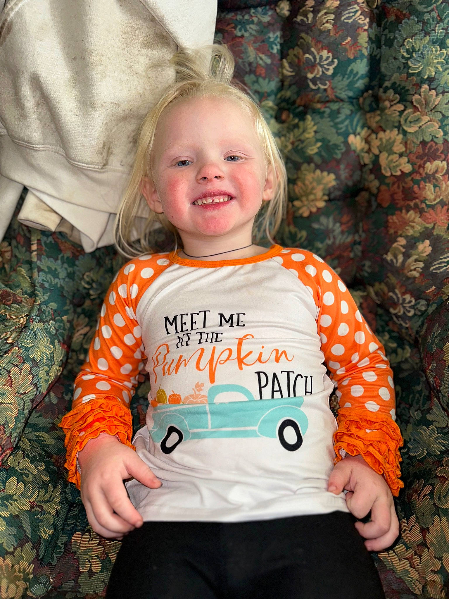Callie is registered to the contest to win money with this photo: baby, baby_products, baby_toddler_clothing, child, clothing, electric_blue, event, fun, hairstyle, happy, joy, pattern, person, product, sitting, sleeve, smile, sportswear, standing, t_shirt